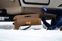 Contractor installing self-regulating low voltage heat trace system in RV