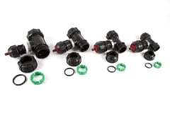 Four Red and Black Philmac Fittings Disassembled with Green Parts
