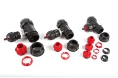 Three Red and Black Philmac Fittings Disassembled