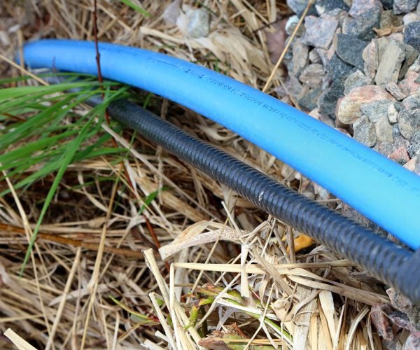 Submersible Pump Wire outdoors on rocks and grass